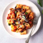 image of tasty sicilian pasta alla norma pasta with aubergines on a white plate