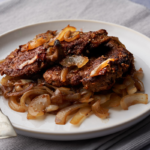 image of fegato in agrodolce a sicilian style veal liver cooked in a sweet and sour sauce and servced with sweet and sour onions