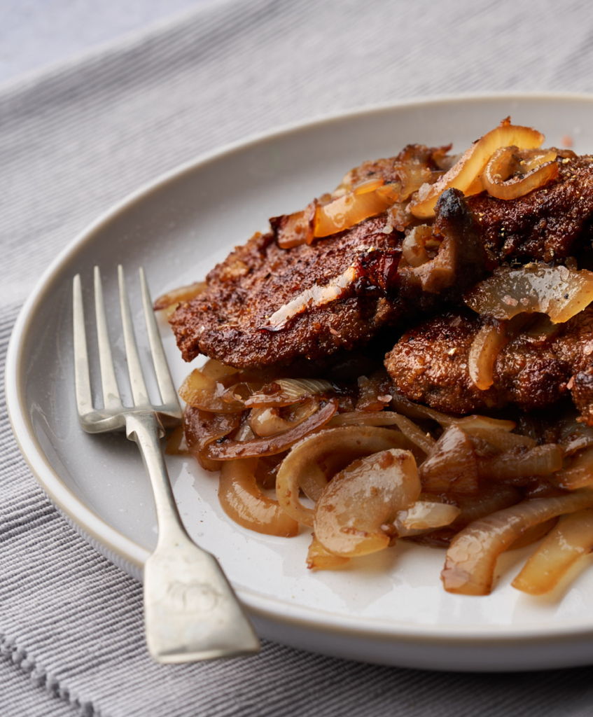 image of fegato in agrodolce a sicilian style veal liver cooked in a sweet and sour sauce and servced with sweet and sour onions