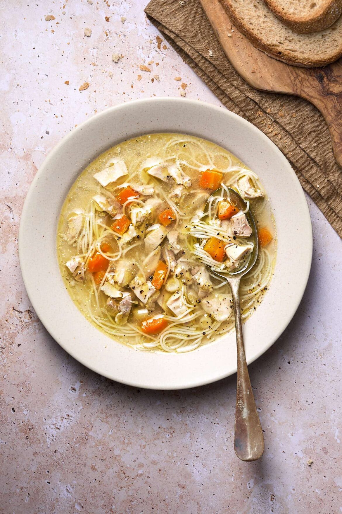 How to Make Hungarian Chicken Noodle Soup warm Hungarian Chicken Noodle Soup served in a rustic style