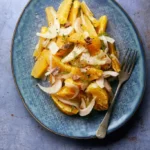 Photo of sicilian orange and fennel salad in a summer setting