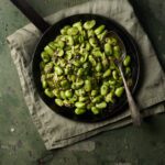 image of Fava 'ngreccia a delicious side dish of Fava beans, anchovies, capers and garlic served in a rustic setting