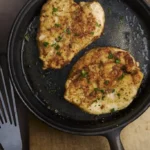 rustic image of petit di pollo alla fiorentina, a delicious floured chicken breast pan fried in butter