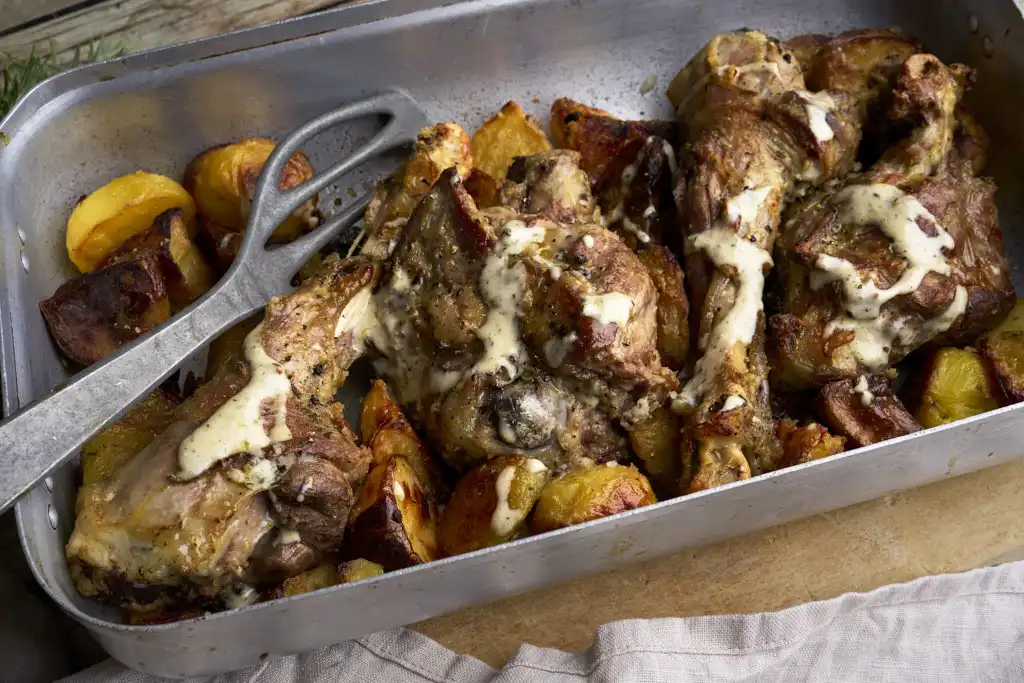 image of the Rome Easter dish Abbacchio alla Romana in a rustic setting