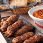 Cevapcici - Balkan grilled sausages served with ajvar