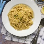 image of pasta al limone, a lemon pasta recipe from Sicily and a classic italian summer recipe often served with spaghetti
