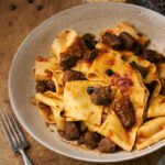 image of Tuscan Wild Boar Ragu in a rustic setting