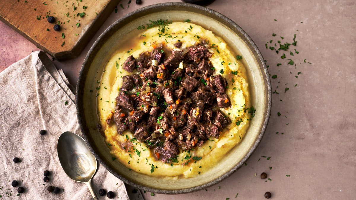 Image of Friuli wild boar ragu marinaded in white wine and juniper berries, served with soft creamy polenta
