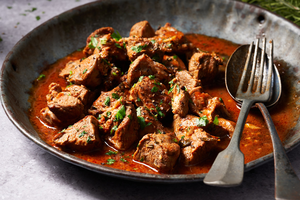 image of Potacchio Marcchegiano, a rustic dish from Italy's Marche region, served in a wide rustic bowl.