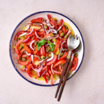 image of Condiglione - Liguria's Summer Salad, in a wide white bowl on the bright background