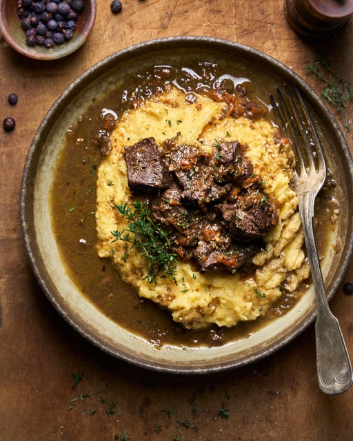 image of karst venison stew in a rustic autumnal setting